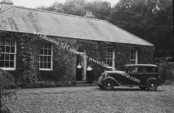 MERCY CONVENT WITH NUNS AT DOOR AND CAR